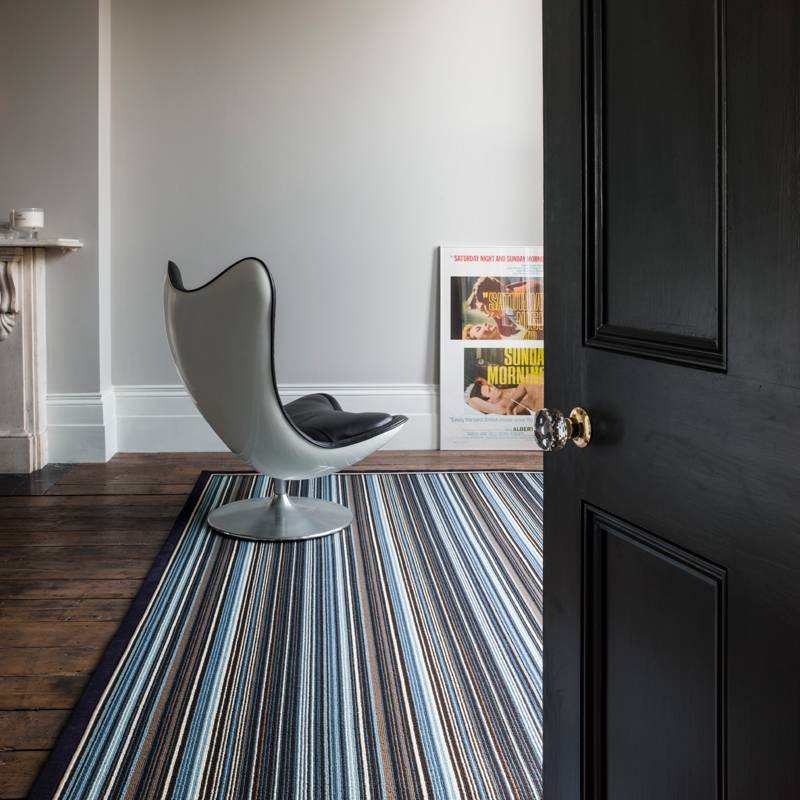 striped natural wool rug in room
